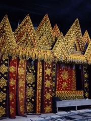 Indonesian cultural moments: ornate stage setup and traditional snacks