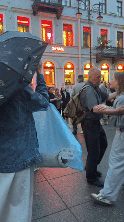 Rainy evening street dancing and live music in Saint Petersburg