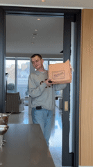 London resident enjoys takeout lunch in modern apartment