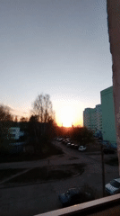 Sunset captured over Chaikovsky urban area from window