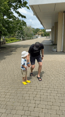 Man and child walk together on path in Nebug