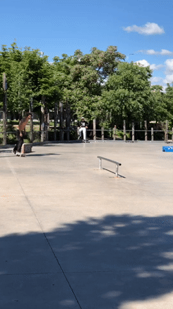 Skateboarder practices rail tricks at Madrid park morning session