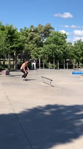 Skateboarder practices rail tricks at Madrid park morning session