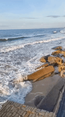 Dusk at a Vietnamese beach resort, waves and poolside views