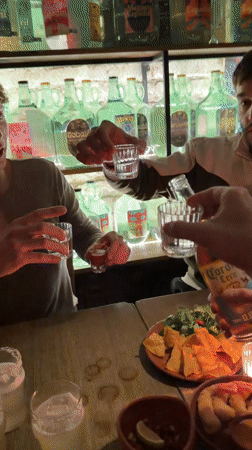 Two men visit Moscow bar with bottle display