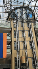 Modern atrium with gold elevator shaft documented in Yerevan