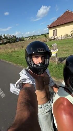 Scooter passengers film ride through Indonesian countryside