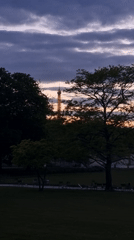 Eiffel Tower captured at twilight amid cloudy Paris sky