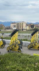 Sochi street scenes: scooters, mountain views, sidewalk musician