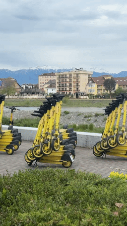 Sochi street scenes: scooters, mountain views, sidewalk musician
