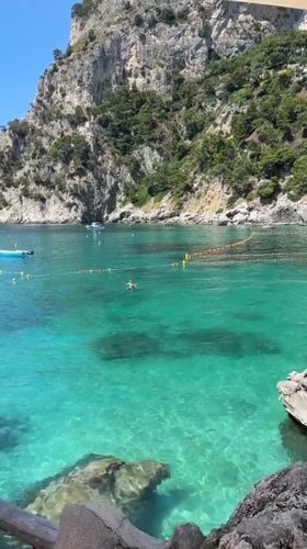 Tourist captures morning scenes exploring Capri's coastline and attractions