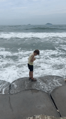 Morning moments at the Hoi An shoreline, waves and all