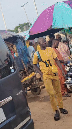 Damaged Toyota draws crowd at Nigeria gas station