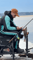 Spring fisherman practices catch-and-release near Chaikovsky, Russia