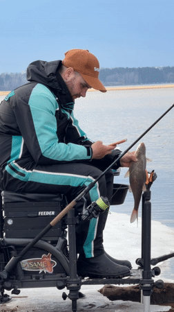Spring fisherman practices catch-and-release near Chaikovsky, Russia