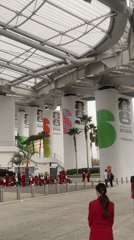 Red-suited group assembles at modern Inglewood stadium entrance