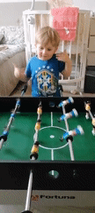 Toddler plays table games in Trubacheyevka, Russia