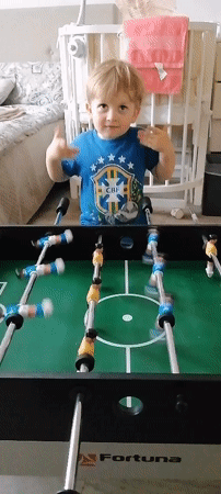 Toddler plays table games in Trubacheyevka, Russia
