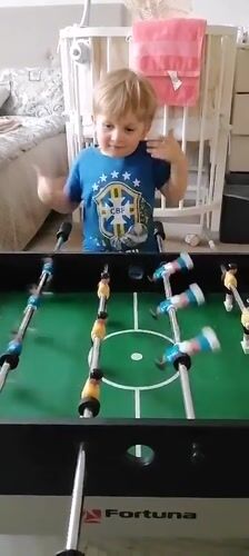 Toddler plays table games in Trubacheyevka, Russia