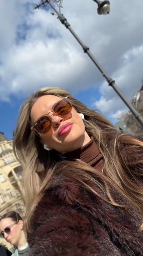 Woman takes multiple selfies on Berlin street