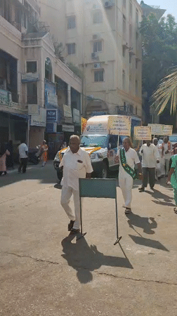 Mobile health display procession moves through Puttaparthi streets