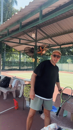 Tennis morning at a Nha Trang court with surrounding street scenes