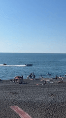 Parasailing and beach activity on Kobuleti's Black Sea shore
