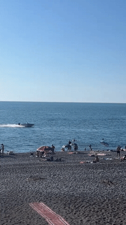 Parasailing and beach activity on Kobuleti's Black Sea shore