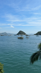 Boats anchored in calm Labuan Bajo harbor waters