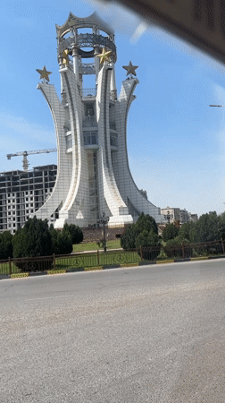 White monument with gold stars documented in Khujand, Tajikistan