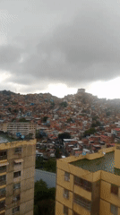 Evening documentation captures Caracas barrios during heavy rainfall