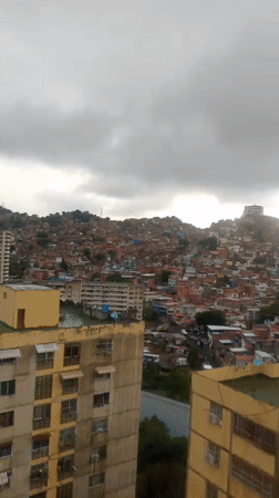 Evening documentation captures Caracas barrios during heavy rainfall
