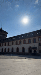Morning documentation of Sforza Castle plaza in sunny Milan