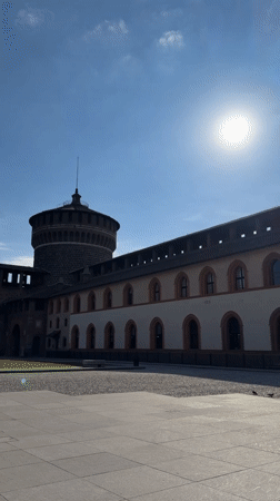 Morning documentation of Sforza Castle plaza in sunny Milan