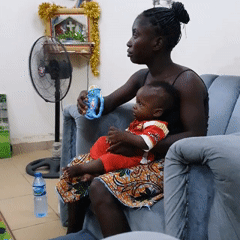 Family shares quiet evening moments with infant at home