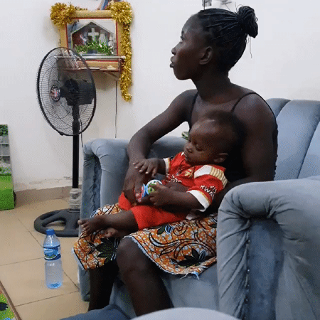 Family shares quiet evening moments with infant at home