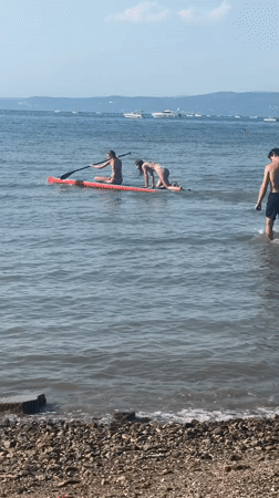Paddleboarding and swimming along the Ankaran coast
