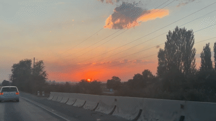 Warm sunset over rural Kyrgyzstan, shot from a moving vehicle