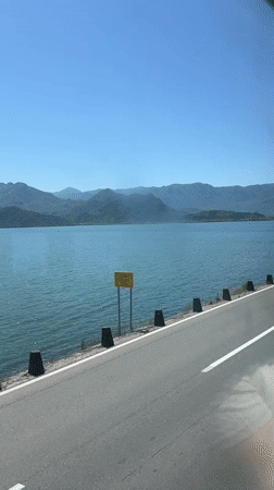 Scenic turquoise lake views documented along Vranjina Montenegro roadway