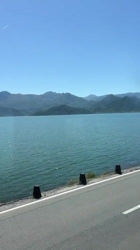 Scenic turquoise lake views documented along Vranjina Montenegro roadway