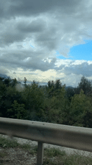 Traveler documents coastal road scenery in Sutomore, Montenegro