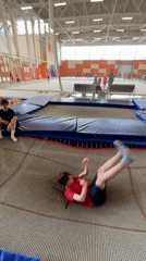 Young gymnasts practice trampoline tricks in Krasnoyarsk facility