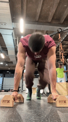 Young man performs handstand exercise at Essen gym