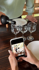 Couple shares wine tasting, selfies by Abkhazia river