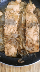 Cooking salmon and green XO letters documented by witness