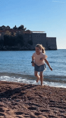 Children and dog enjoy sunny afternoon at Sveti Stefan beach