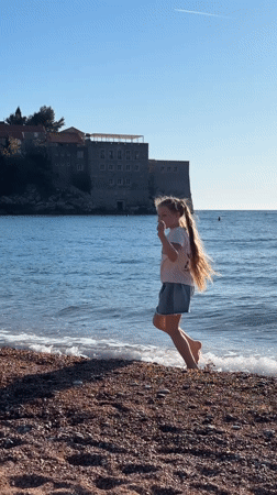 Children and dog enjoy sunny afternoon at Sveti Stefan beach