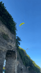 Morning scenes captured in Kuta Selatan: paragliders, traffic, statue