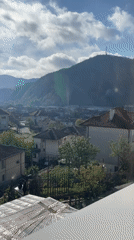 Morning window view captures sunny Zlatograd landscape with mountains