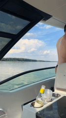 Afternoon boat ride on a calm, tree-lined waterway